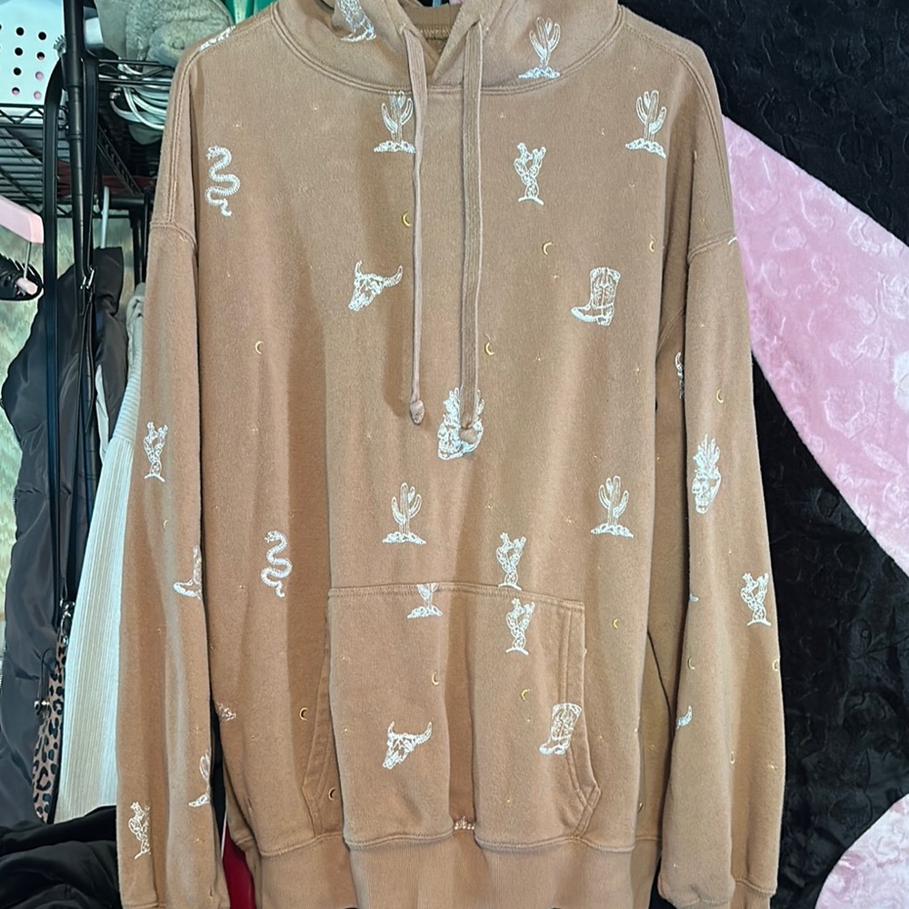 light brown hoodie with cactus & skull details